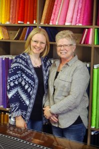 Photo by Don Lipps - Owner Laurel Ballman and employee Julia Oas stand ready to offer the help you need with your quilting project.