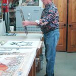 Bob Vogel of Stained Glass Studio in St. Peter working on a project.