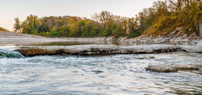 Photo by Rick Pepper - Looking south onto the Blue Earth River, notice the wood structure under concrete