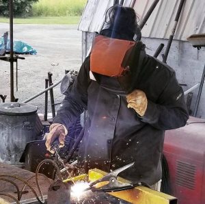 Photo by Kyle Zeiszler - Project Bike 2018 - Artist Margarita Jane Arguedas welds rebar together to simulate fabric strands