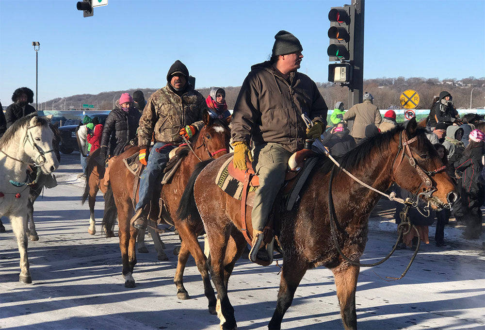 Photo by Gary Pettis - Dakota 38+2 Memorial riders arrive in Mankato on December 26th, 2017