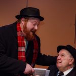 Photo by Charlie Berg - Uncle Billy (Jerad Lanes), on his way to make a bank deposit, stops to talk to Mr. Potter (Tim Berry)