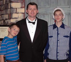 Photo by Don Lipps - Matthias Guetschow (Tommy Bailey), Tim Guetschow (Harry Bailey), and Chris Guetschow (Pete Bailey) in costume before dress rehearsal of the Centenary Methodist Drama Ministry production of It's a Wonderful Life