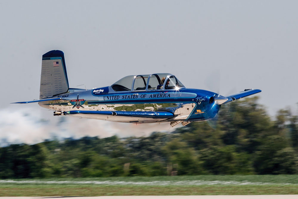 Photo by Rick Pepper - 2012 Mankato Air Show - Julie Clark in her T-34 Mentor makes a pass