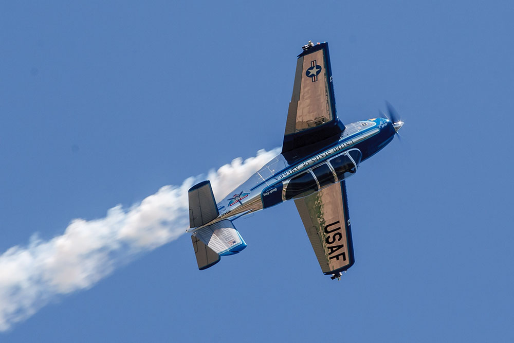 Photo by Rick Pepper - 2012 Mankato Air Show - Julie Clark takes her T-34 Mentor into a rolling loop