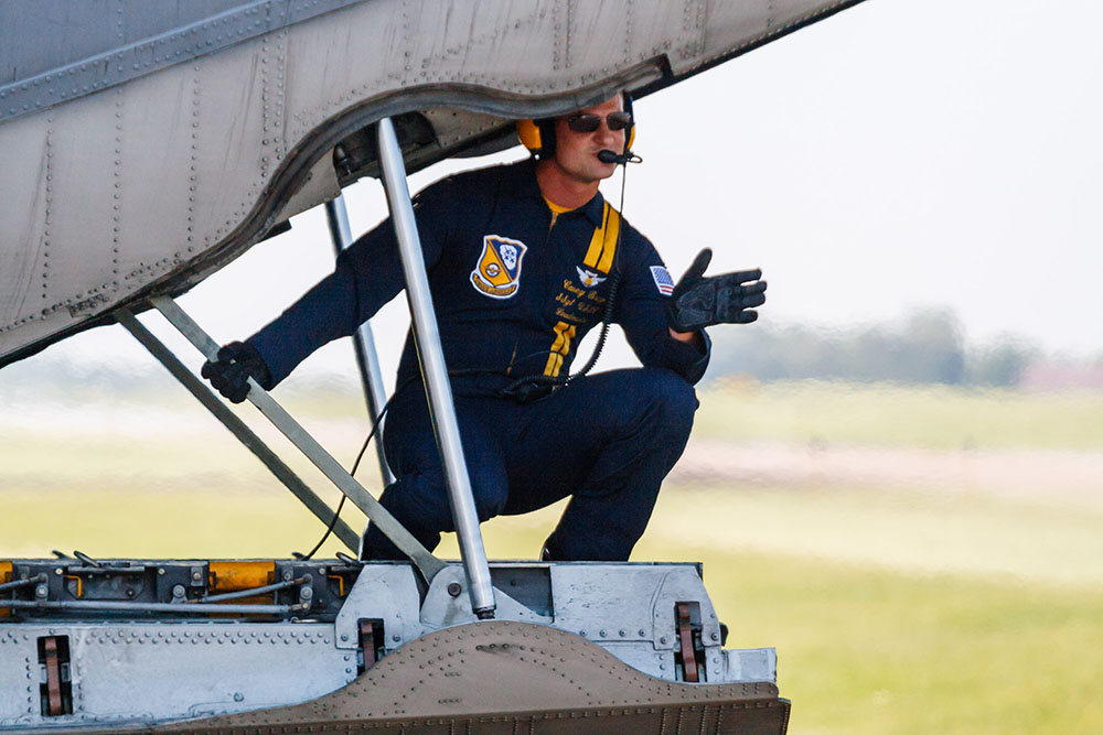 Photo by Rick Pepper - 2012 Mankato Air Show - A member of the Blue Angel C-130 crew waves to the camera