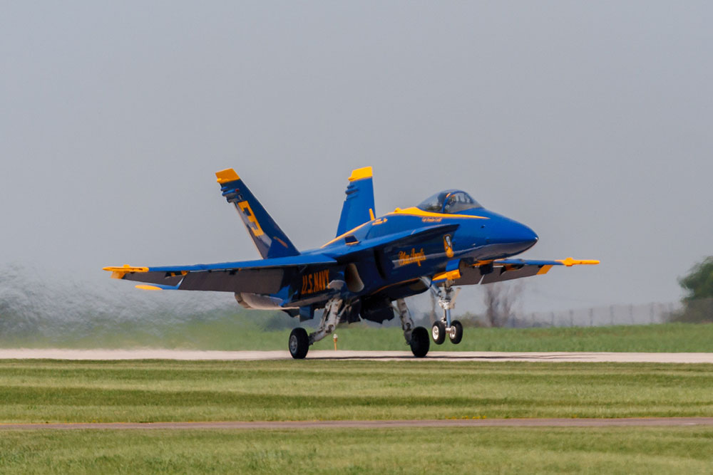 Photo by Rick Pepper - 2012 Mankato Air Show - The nose gear of Blue Angel #3 aircraft leaves the ground