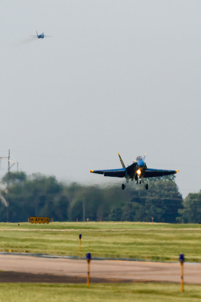 Photo by Rick Pepper - 2012 Mankato Air Show - Blue Angel #6 aircraft (opposing solo) lands due to a clipboard that had come loose in the cockpit right after take-off.