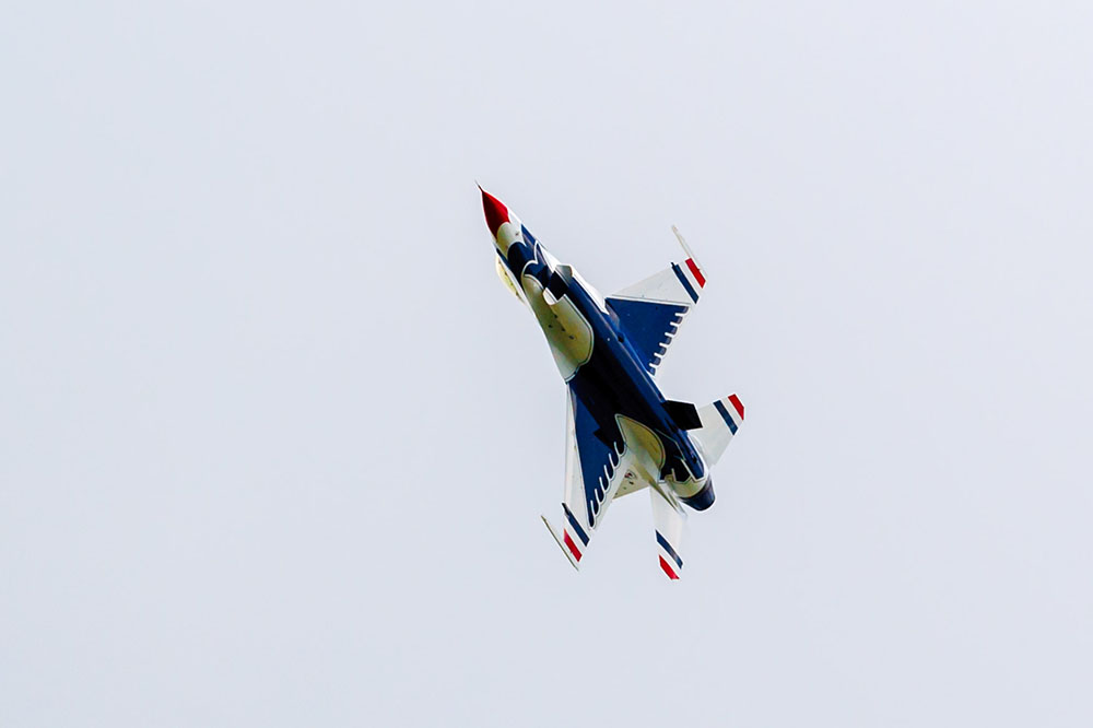 Photo by Rick Pepper - 2015 Mankato Air Show - One of the solo Thunderbird aircraft turns to re-position for the next maneuver