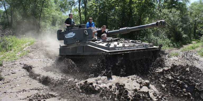 Photo courtesy of Drive A Tank - FV433 Abbot driving through the mud