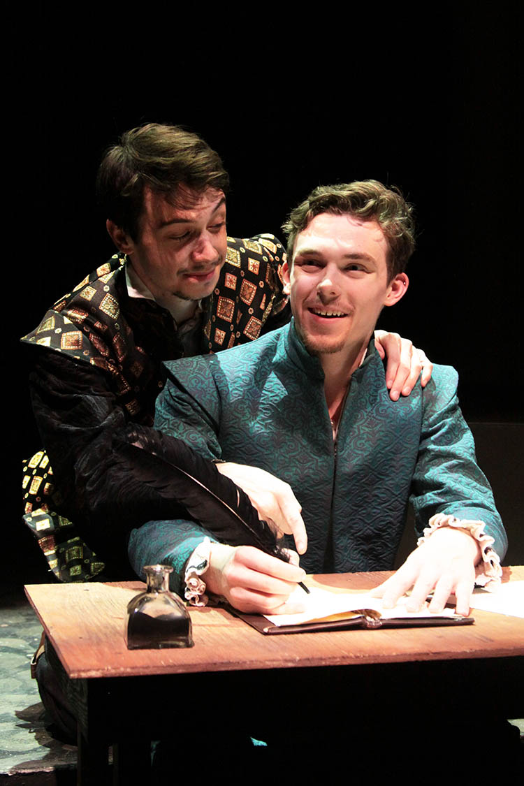 Photo courtesy Minnesota State University, Mankato Department of Theatre & Dance - Christopher Marlowe (Mack Spotts) helps his good friend William Shakespeare (Ryan Joseph Feist) with his severe writer’s block.