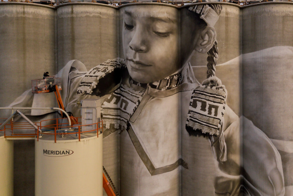 Photo by Rick Pepper - Aerial view Australian artist, Guido van Helten at work on the Ardent Mill grain silos.