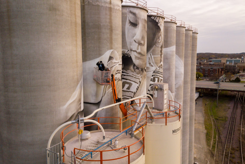 Photo by Rick Pepper - Aerial view Australian artist, Guido van Helten at work on the Ardent Mill grain silos.