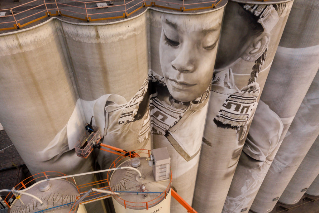 Photo by Rick Pepper - Aerial view Australian artist, Guido van Helten at work on the Ardent Mill grain silos.