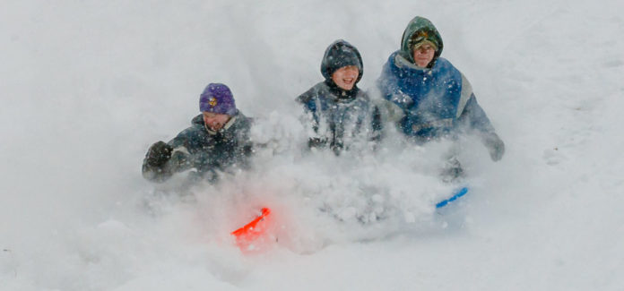 Photo by Rick Pepper - Alec Maertens, Jacob Pepper, Christian House on the Spring Lake Park sliding hill