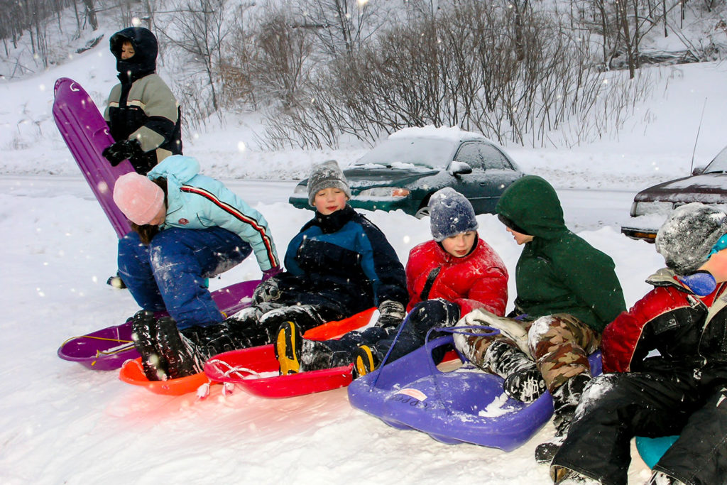 Photo by Rick Pepper - Pepper kids and friends on the Spring Lake sliding hill