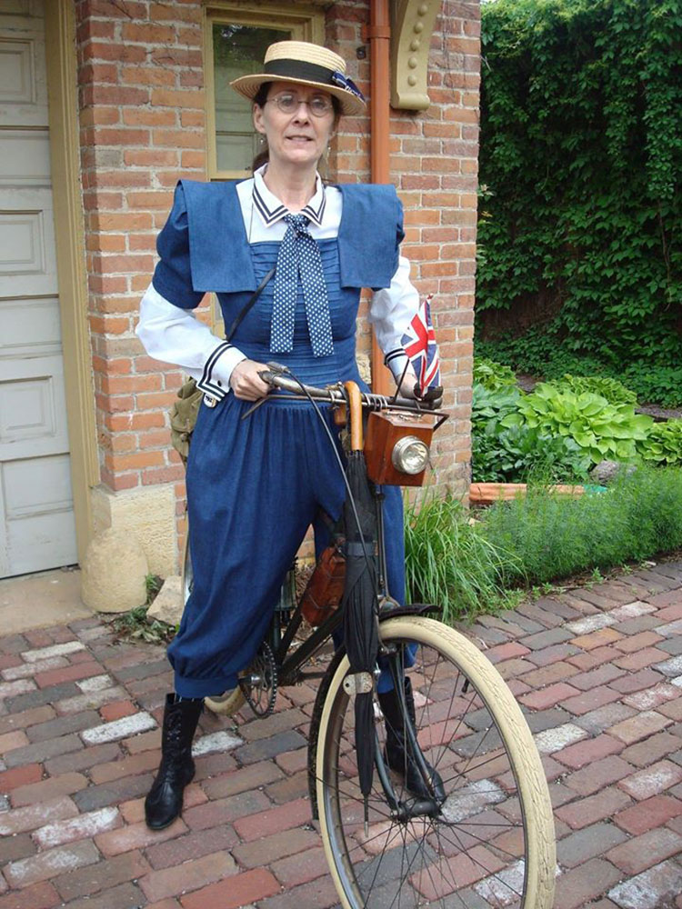 Submitted Photo - Susan Hynes as one of her many characters near the Hubbard House carriage building.