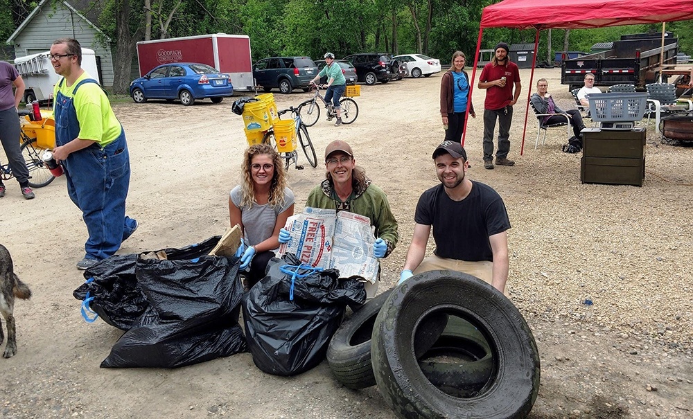 Submitted Photo - Kate Barnes, Paul Ebbenga and Mike Sargent show off their haul from a street cleanup event hosted by the Mankato Makerspace