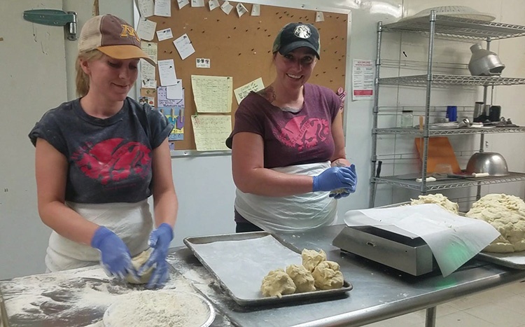 Submitted Photo - Sarah Busch and Liberty Warren making pie crusts at The Cheese and Pie Mongers in St. Peter
