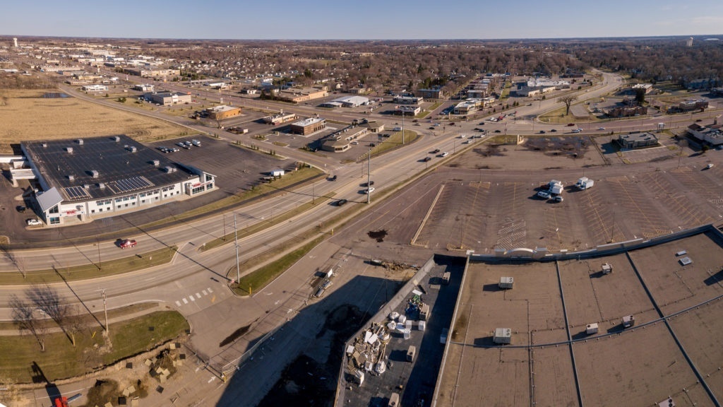 Photo by Rick Pepper - Aerial view of the roof of Madison East Mall above the new construction looking south