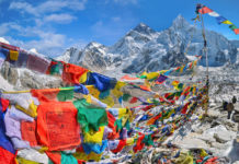 View of Mount Everest and Nuptse with buddhist prayer flags from kala patthar in Sagarmatha National Park in the Nepal Himalaya