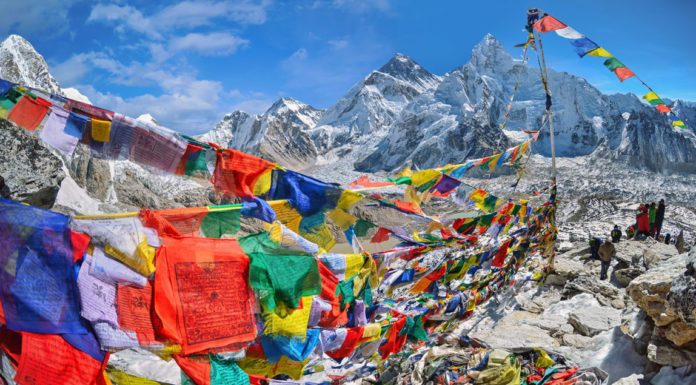 View of Mount Everest and Nuptse with buddhist prayer flags from kala patthar in Sagarmatha National Park in the Nepal Himalaya