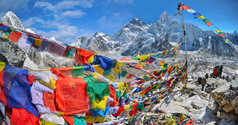 View of Mount Everest and Nuptse with buddhist prayer flags from kala patthar in Sagarmatha National Park in the Nepal Himalaya