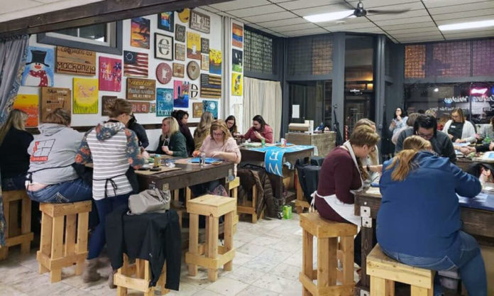 Submitted Photo - Participants at work at Design & Wine's space on Belgrade Avenue in North Mankato