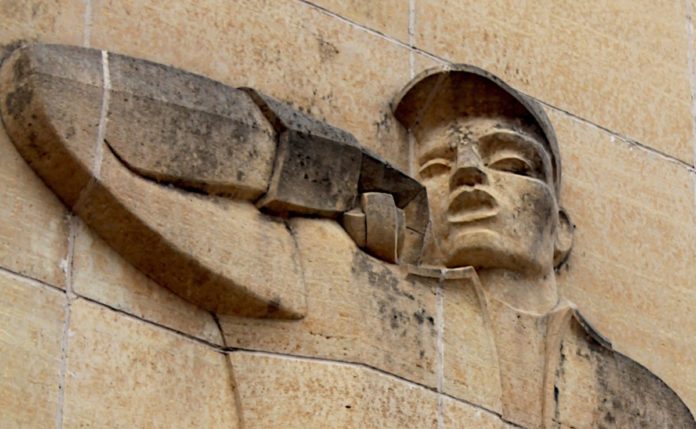 Photo by Mike Lagerquist - Detail of the Lineman on the Consolidated Communications building in Mankato