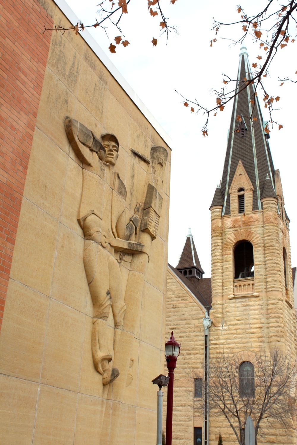 Photo by Mike Lagerquist - The Lineman on the Consolidated Communications building with First Presbyterian Church in the background at the corners of S Broad and E Hickory Streets in Mankto