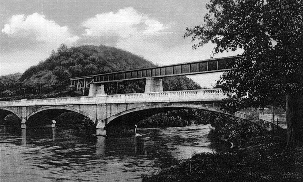 From History of the Red Jacket Valley by Julie A. Schrader - Post card of the Red Jacket Bridge and Trestle, circa 1912