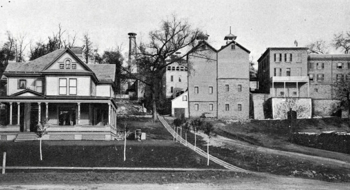 Photo from the Standard Historical and Pictorial Atlas and Gazetteer of Blue Earth County, MN, 1895 - The Bierbauer Brewery stood at the end of Rock Street in Mankato for many years. The brewery buildings are now gone. Albert and Lillie Bierbauer’s house, which is pictured on the left, still remains on the corner of 6th and Rock Streets. This photo was taken in 1895 and at the time the brewery was producing 18,000 barrels annually.