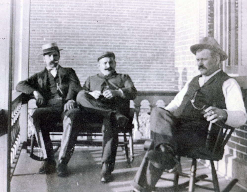 Photo courtesy of the Blue Earth County Historical Society - Left to right: Albert, Rudolph and William Bierbauer on the veranda at the brewery.