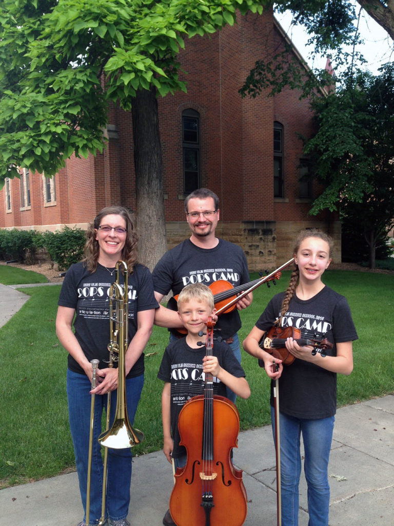 Submitted Photo - The Davis family: Viktoria, Steve, Karl, and Katharine, at New Ulm Suzuki Pops Camp, 2015