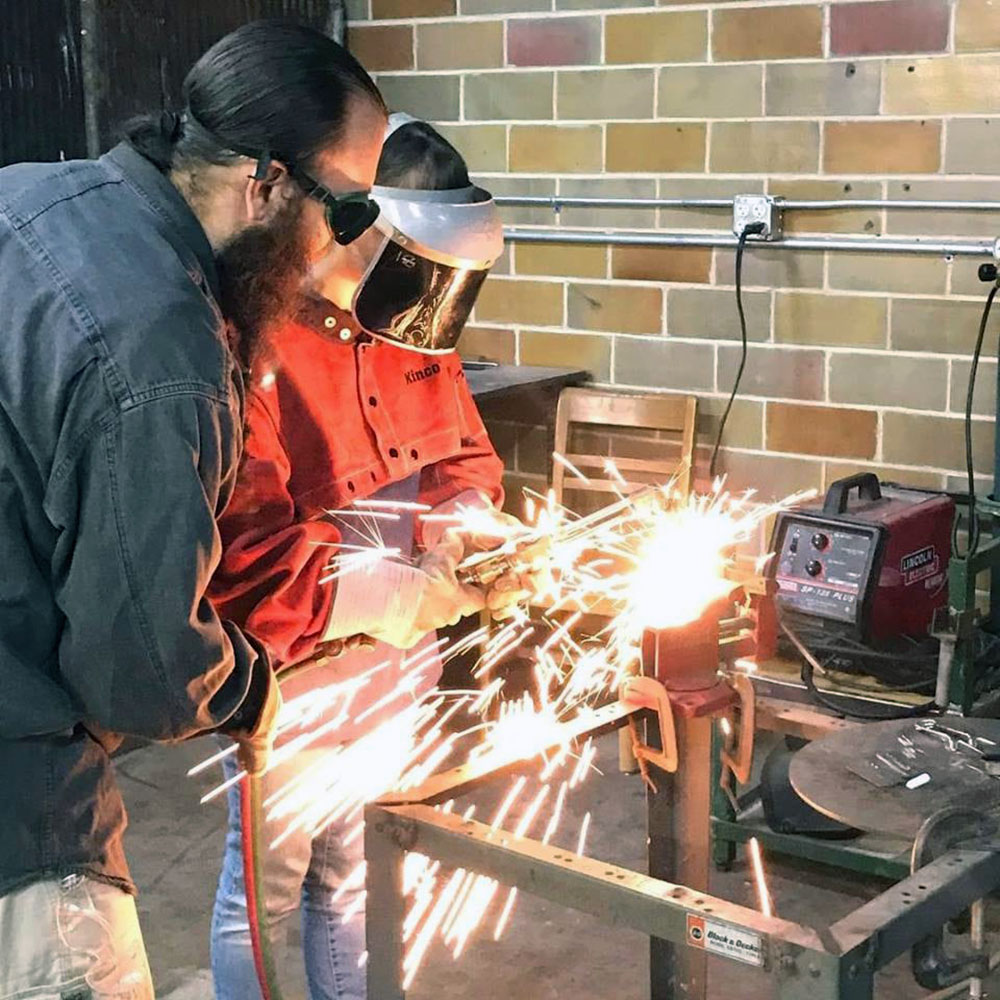 Submitted Photo - Mankato Makerspace board member, Dustin Swiers, instructing a welding student
