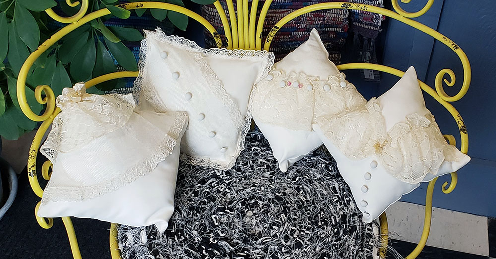 Submitted Photo - Pillows made from a wedding dress at Pins and Needles Alterations in Mankato