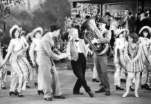 Photo courtesy Muriel Kuebler Berndt - Muriel and Barbara Kuebler in “50 Miles from Broadway,” one of the “short” pictures produced by Pathe Films to run in theaters between newsreels and the main feature. Barbara is third from the left and Muriel is to the immediate right of the tuba player.