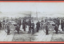 Photo from the Library of Congress - General William T. Sherman, center, leaning on the breach of a cannon, with his staff at Federal Fort No. 7 near Atlanta, Georgia in this stereopticon slide.