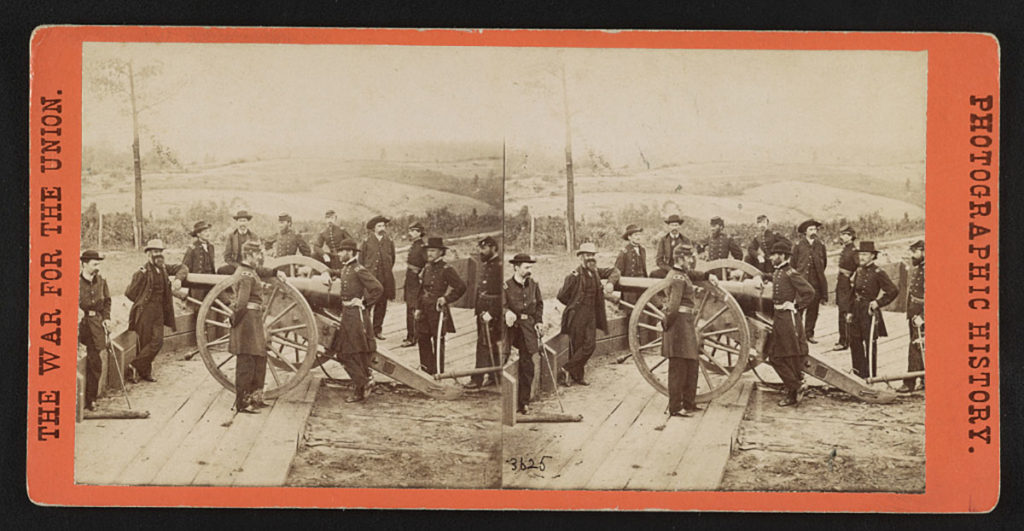 Photo from the Library of Congress - General William T. Sherman, center, leaning on the breach of a cannon, with his staff at Federal Fort No. 7 near Atlanta, Georgia in this stereopticon slide.