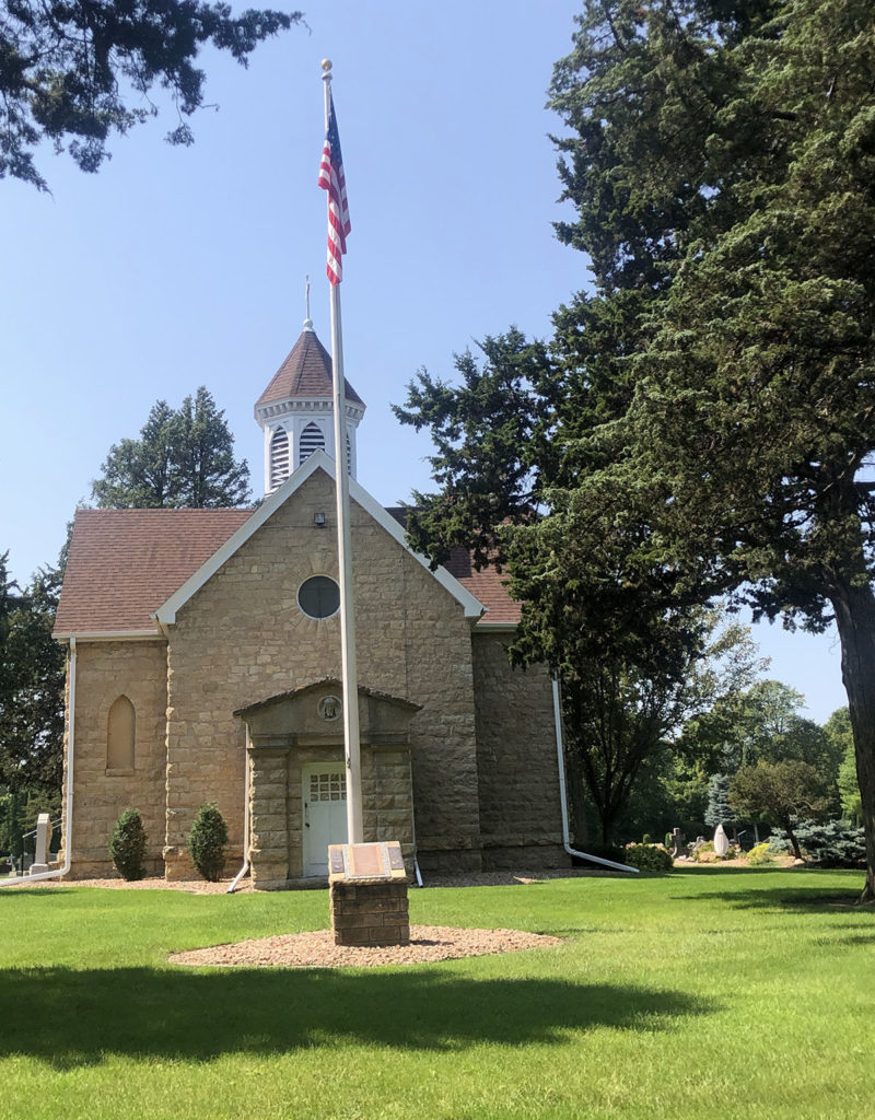 Photo by Mike Lagerquist - The chapel at Calvary Cemetery was built in 1895. The flag pole honors veterans.