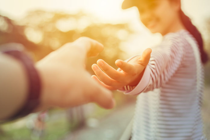 Hands reaching for a connection