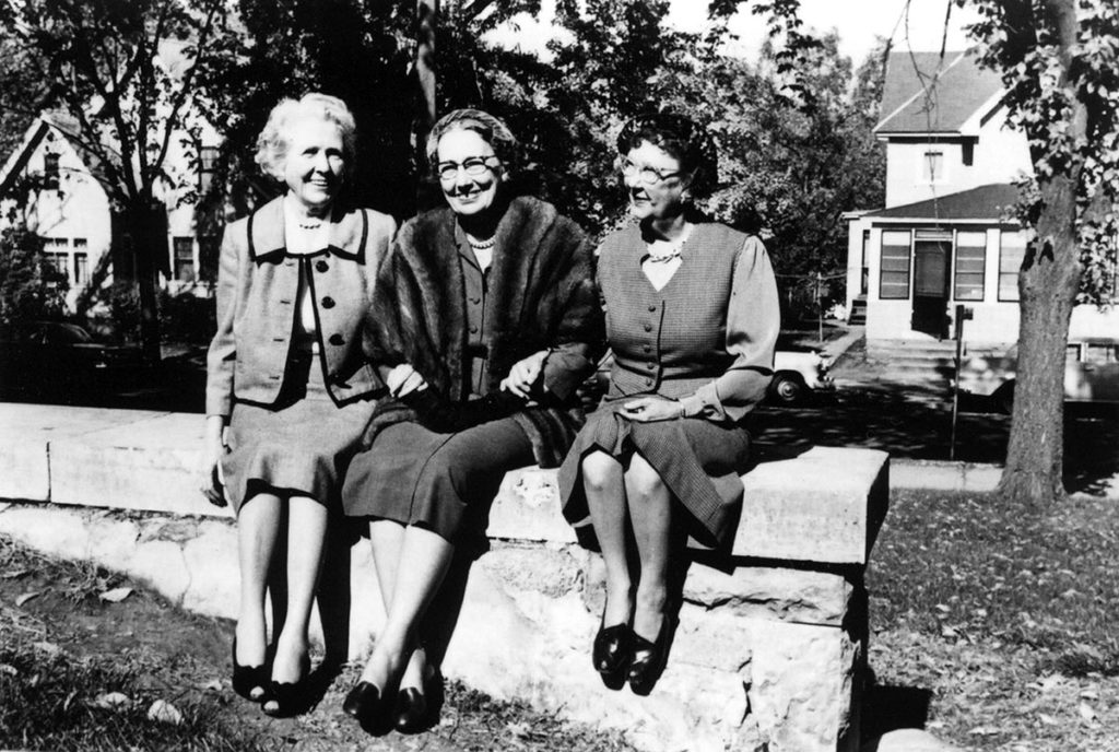 Photo from The Mankato Free Press - The Immortal Trio - L-R: Frances Kenney Kirch (Tacy), Maud Hart Lovelace (Betsy), and Marjorie Gerlach Harris (Tib). This photograph was taken outside Lincoln School (now Lincoln Community Center) in October 1961 when the three attended “Betsy-Tacy Days” in Mankato.