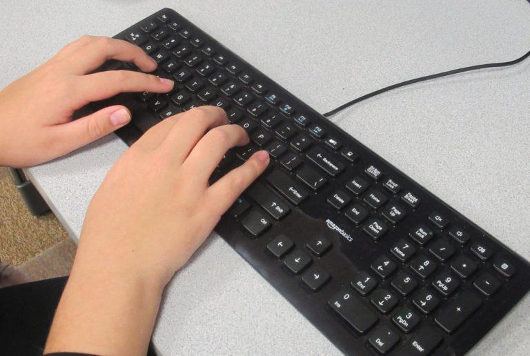 Photo by Grace Brandt - Coding at Maverick Software in Mankato