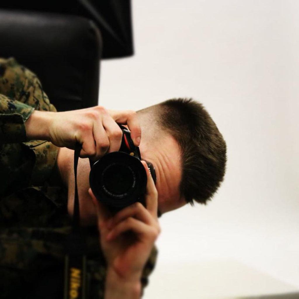 Photo by Ben Larsen - Marine Gage Cureton takes pictures during a training exercise.