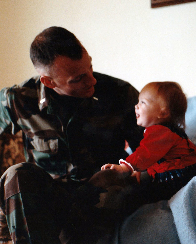 Submitted Photo - 1st Lt. Bradley Webb holds his daughter, Grace (Webb) Brandt.