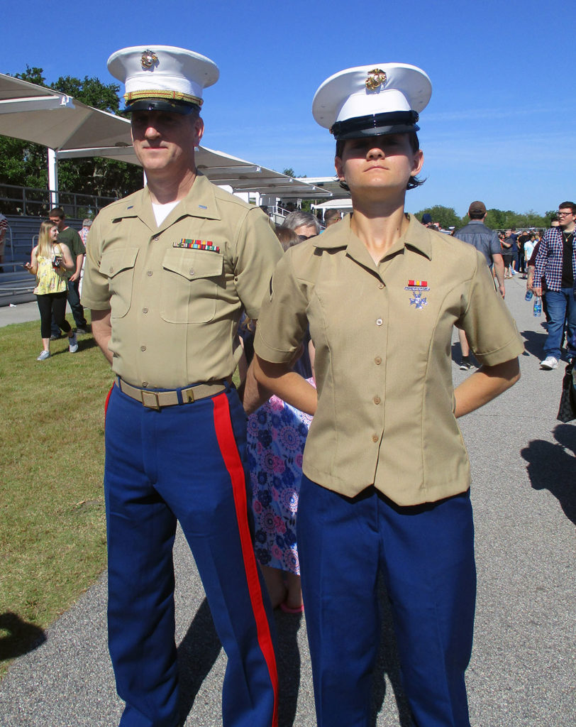 Photo by Grace Brandt - Private First Class Faeth Webb stands next to her father Bradley Webb on the day she graduated from Marine Corps boot camp.