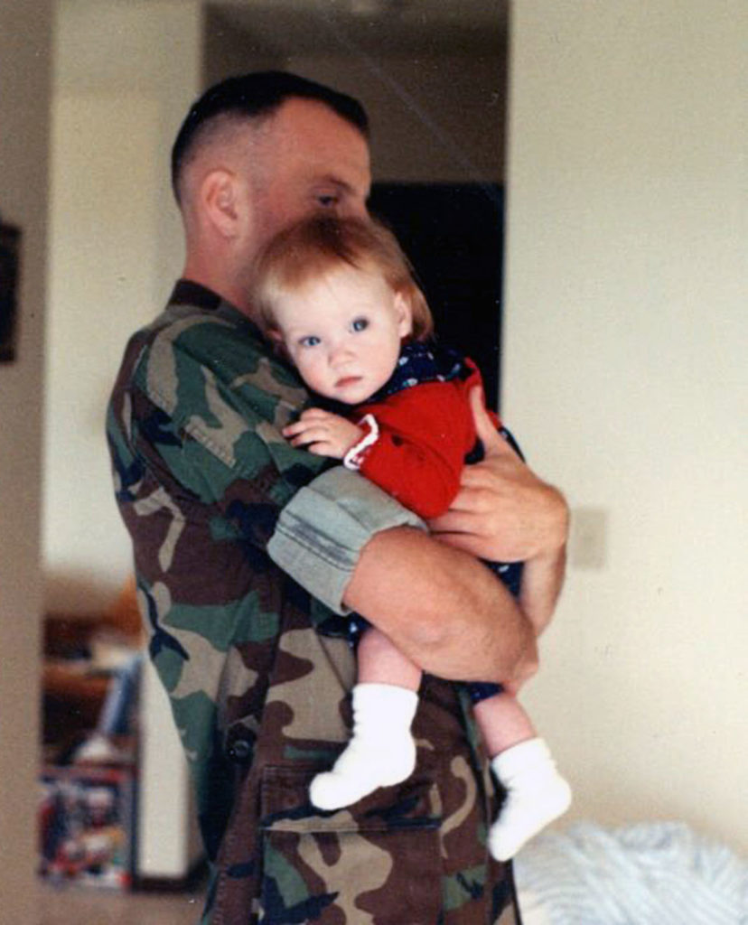 Submitted Photo - 1st Lt. Bradley Webb holds new daughter Grace (Webb) Brandt