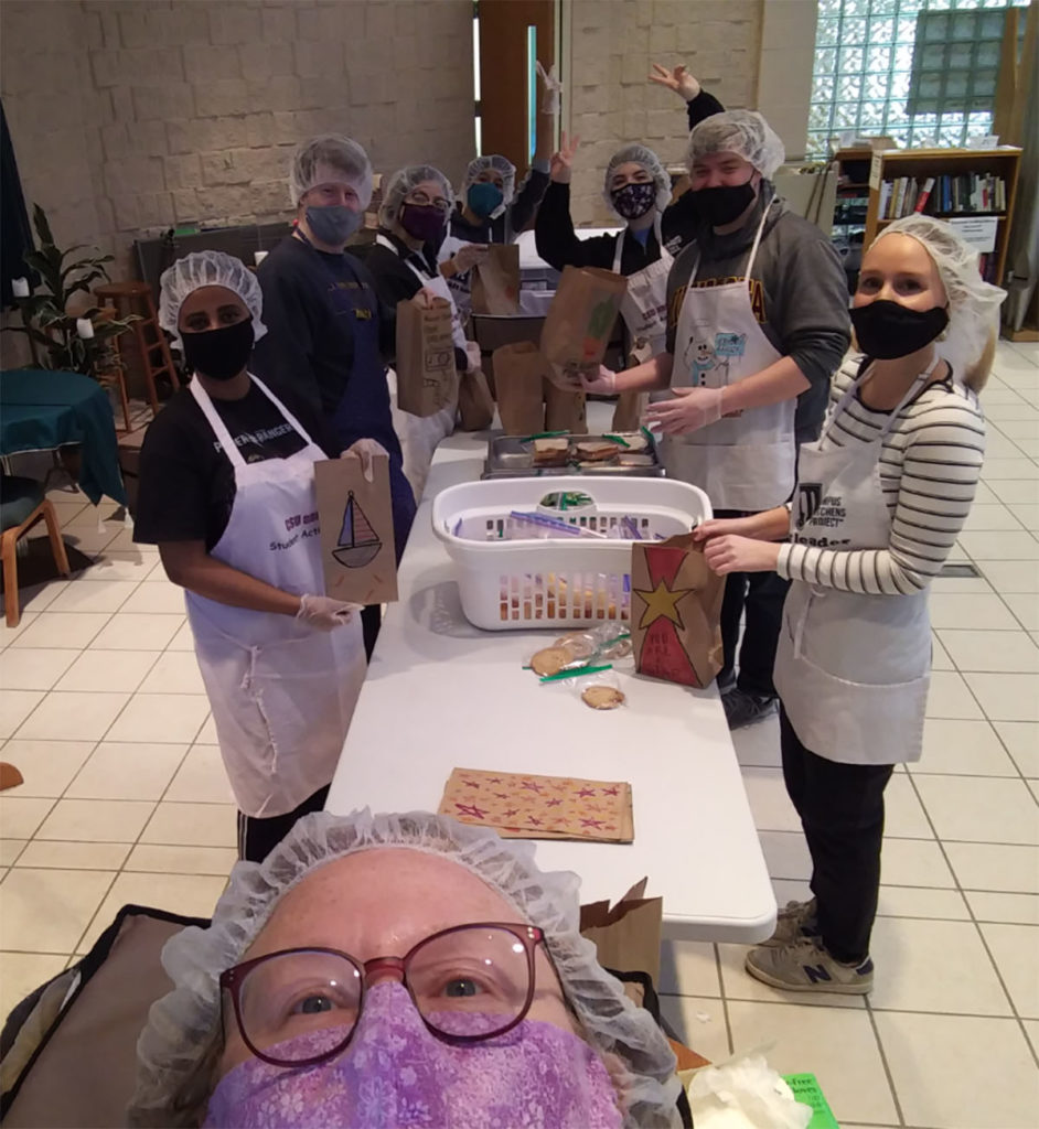 Photo by Karen Anderson - Karen Anderson photo-bombs her own image of volunteers at MSU Mankato's Campus Kitchen