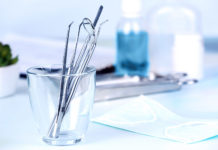 Dentist tools in glass table close up