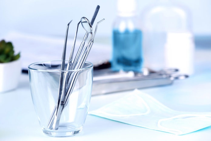 Dentist tools in glass table close up